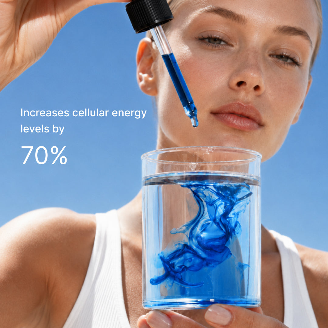 A woman holding a glass of water with blue liquid dispersing in it, captioned increases cellular energy levels by 70 percent.