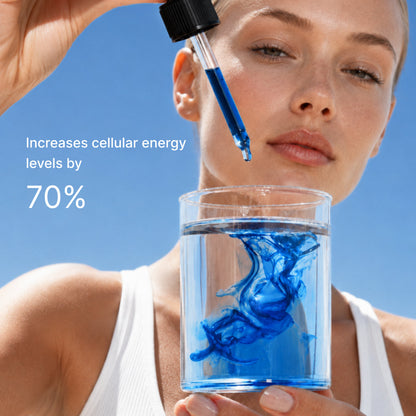 A woman holding a glass of water with blue liquid dispersing in it, captioned increases cellular energy levels by 70 percent.